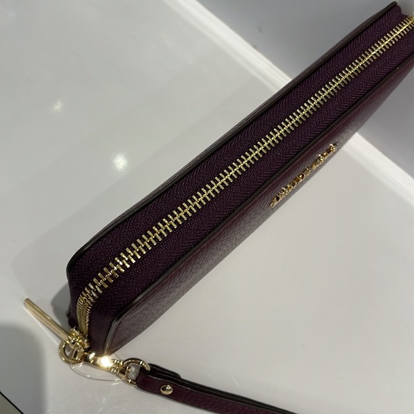 MICHAEL KORS LARGE TRAVEL CONTINENTAL WRISTLET WALLET PHONEHOLDER OXBLOOD - Picture 16 of 16